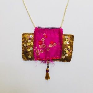 Handmade one of a kind up-cycled fabric necklace.